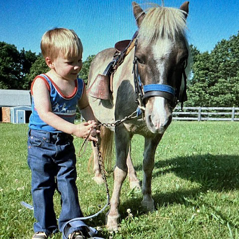 child and pony